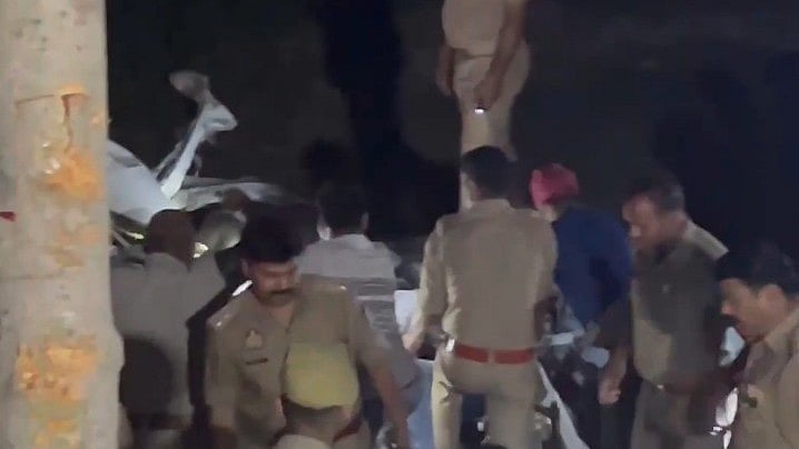 Policemen at the accident site in Lakhimpur Kheri.