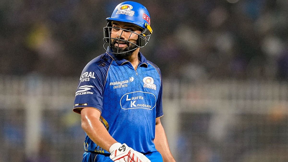 Rohit Sharma walks back to the pavilion after his dismissal