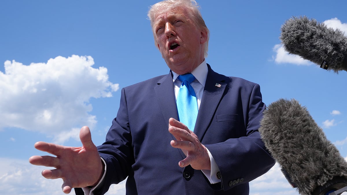Donald Trump speaks to the press after stepping off Air Force One.