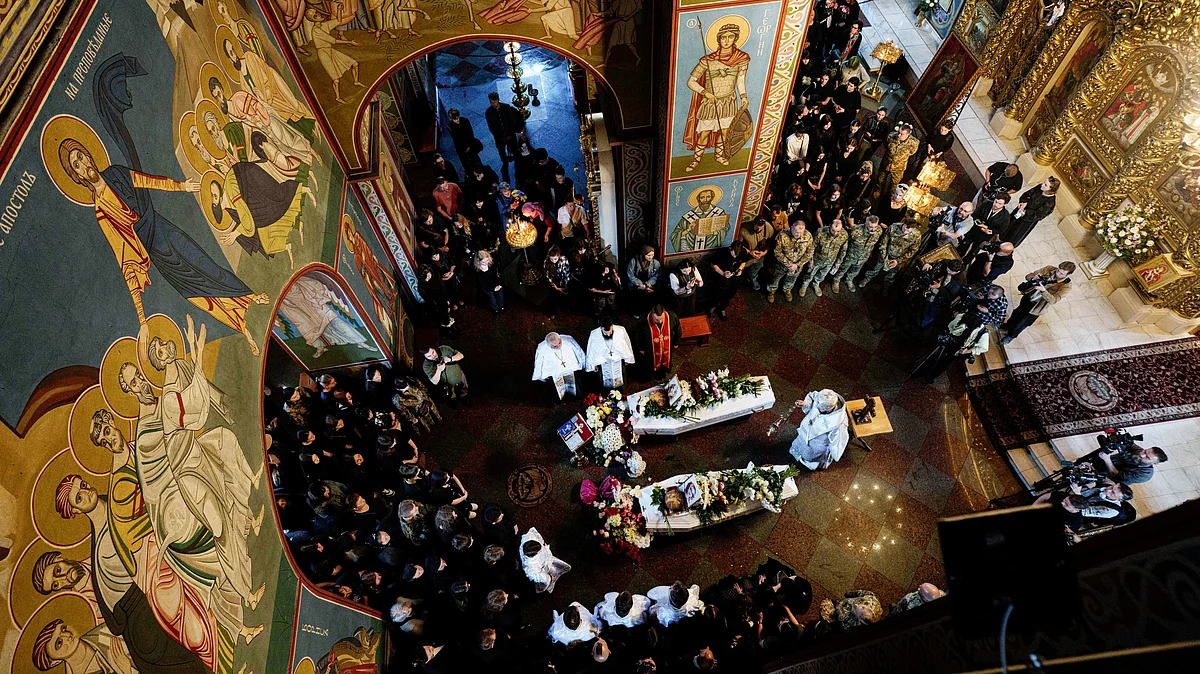 A funeral for sisters Liubava and Vira Yakovleva, killed by a Russian rocket strike, in Kyiv, 19 May