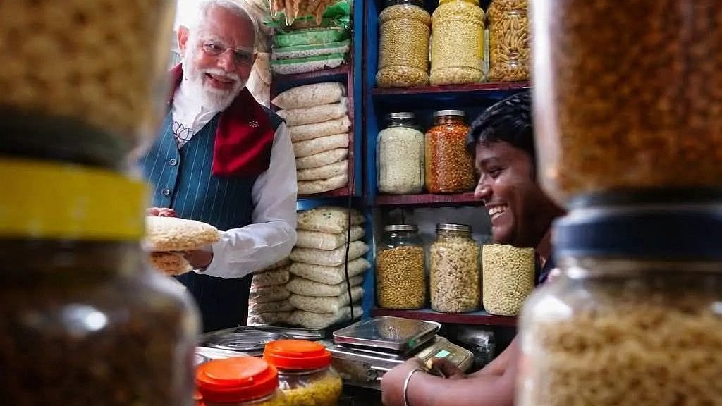 Vikram Shaw serves Jhalmuri to PM Narendra Modi in Jhargram.