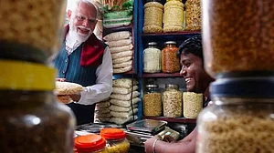 Vikram Shaw serves Jhalmuri to PM Narendra Modi in Jhargram.