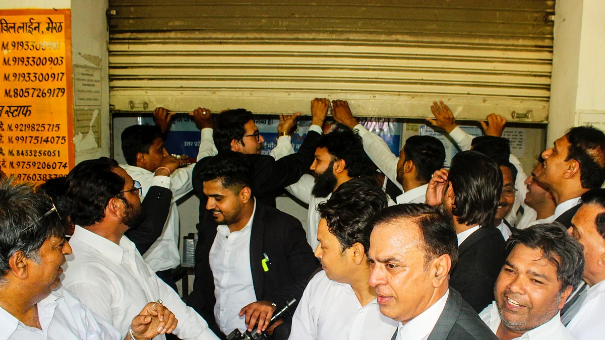 Lawyers protest prolonged power outages at a power station, in Meerut, 21 May
