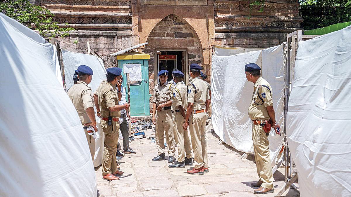 Security personnel at the 700-year-old Kamāl Maula mosque in Dhar