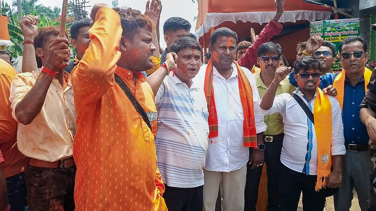 BJP supporters celebrate outside a counting centre at Falta, 24 May