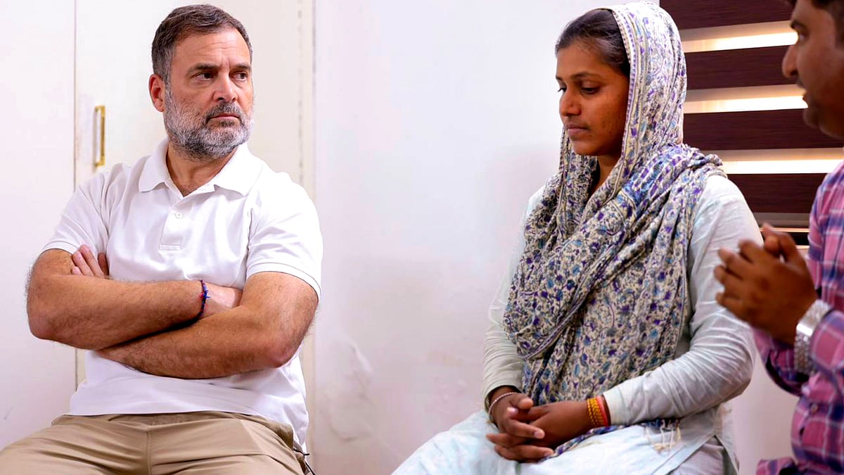 Rahul Gandhi with family members of Pradeep Meghwal