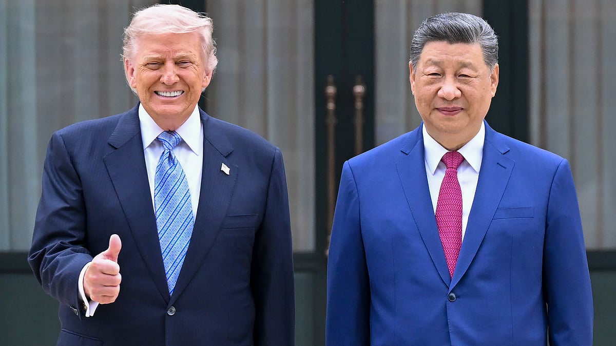Donald Trump poses for a picture with Xi Jinping in Beijing.