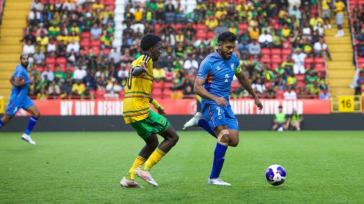 India's Rahul Behke (blue) in a tussle with a Jamaican player on Wednesday
