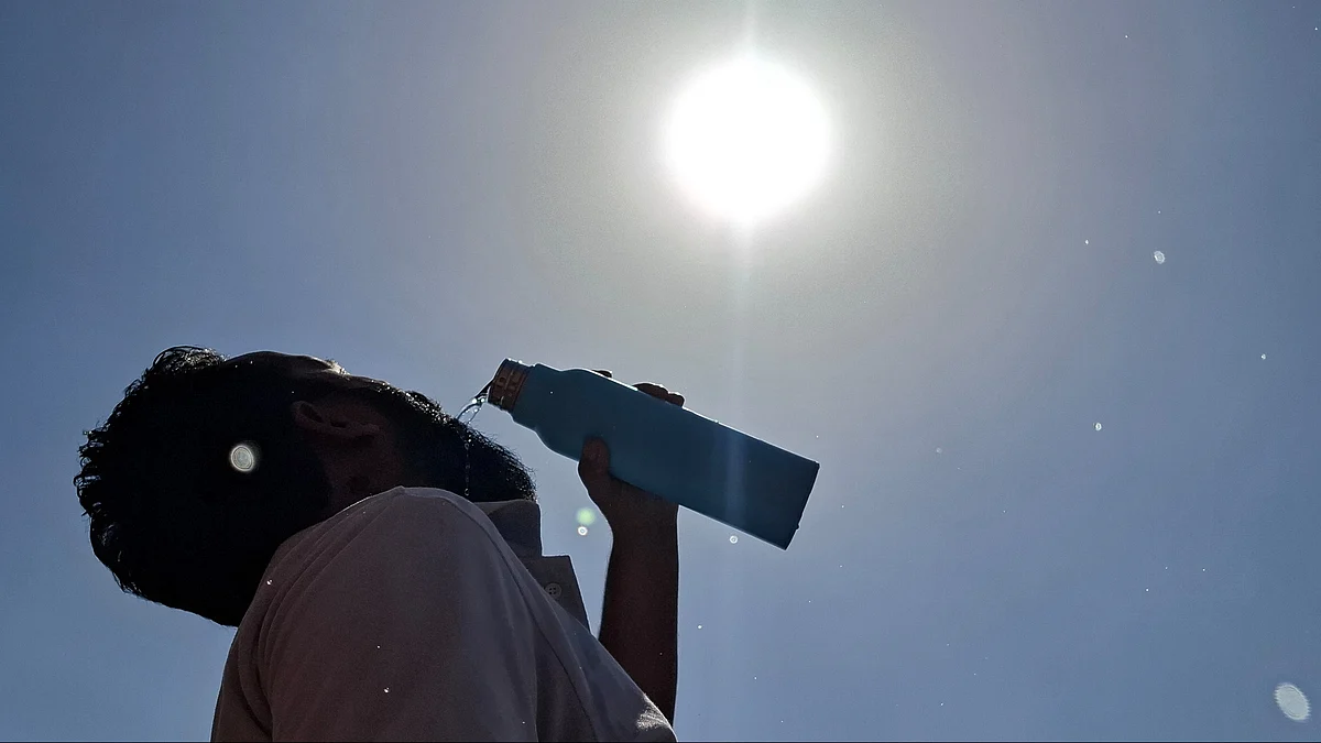 A man quenches his thirst amid scorching heatwave conditions in Jammu.