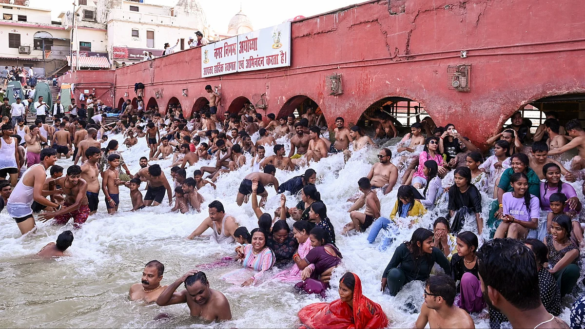 People take a dip at Ram ki Paidi ghats in Ayodhya.