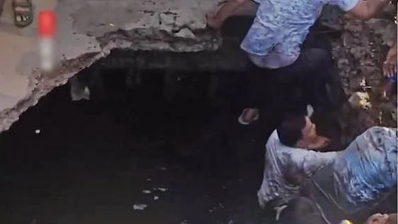 The collapse caused several students standing on the slab to fall into the drain.