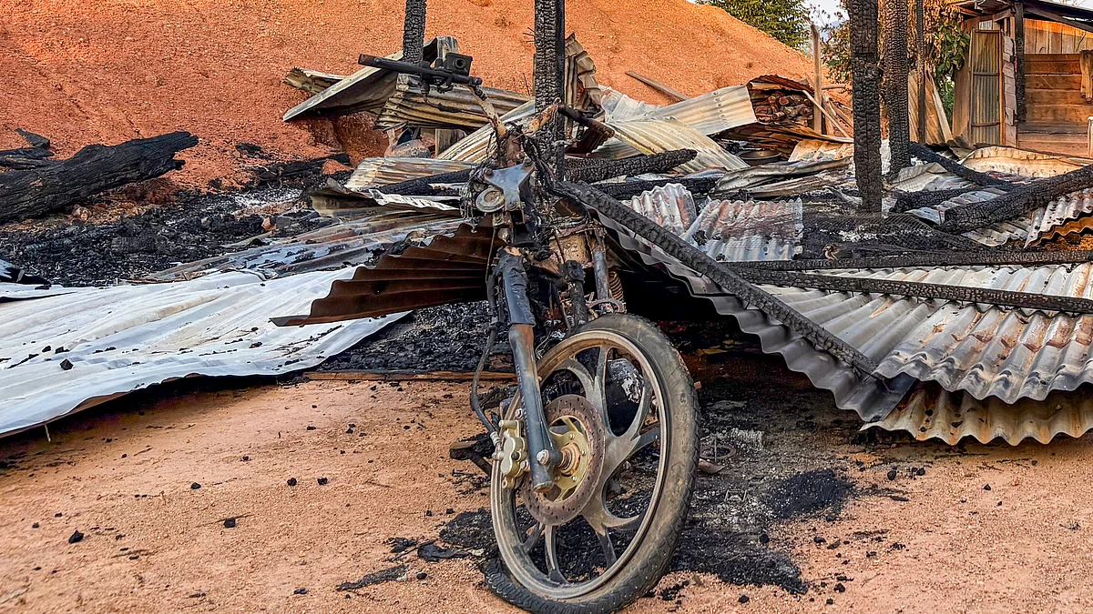 Burnt vehicles lie damaged in Kamjong district.