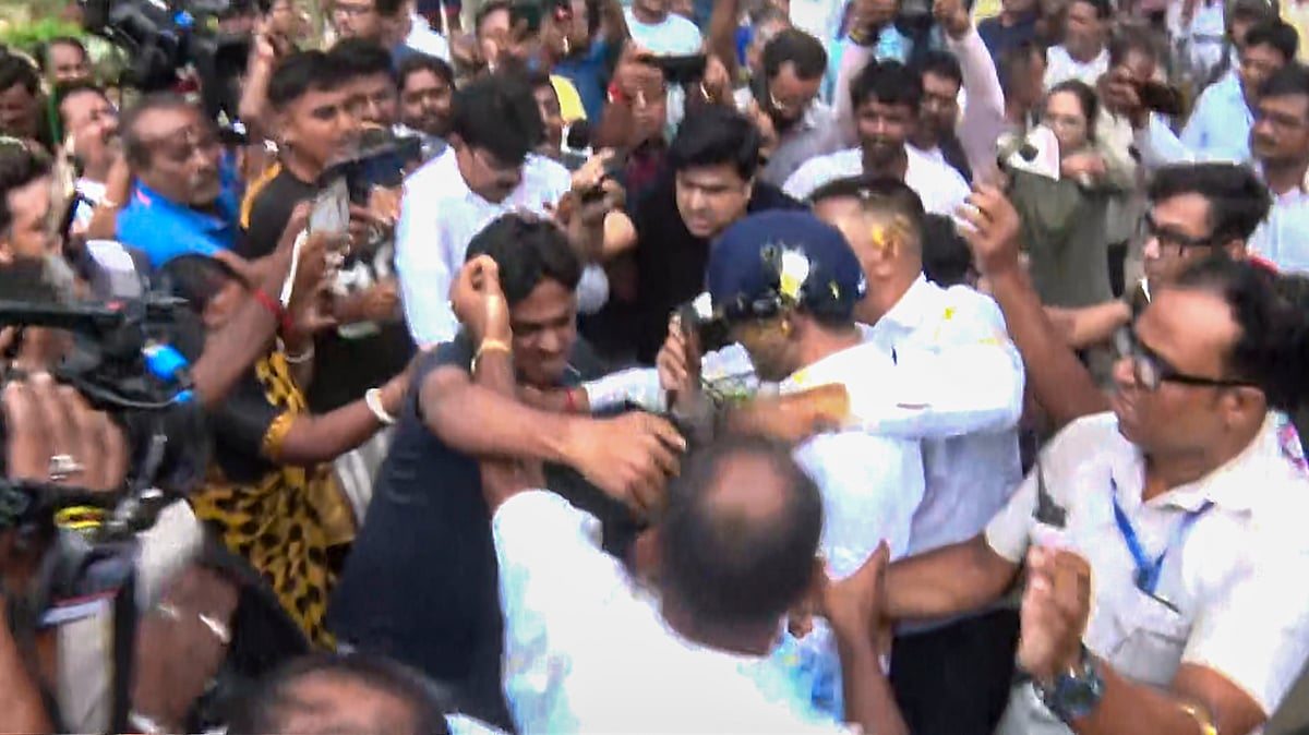 Abhishek Banerjee (in helmet) as stones, shoes and eggs are hurled at him in Sonarpur, 30 May