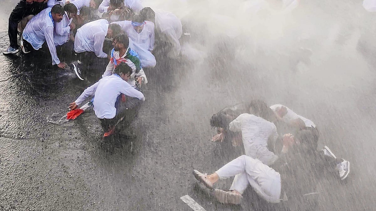Water cannons being used on NSUI members during a protest over the NEET paper leak in Bhopal, 30 May