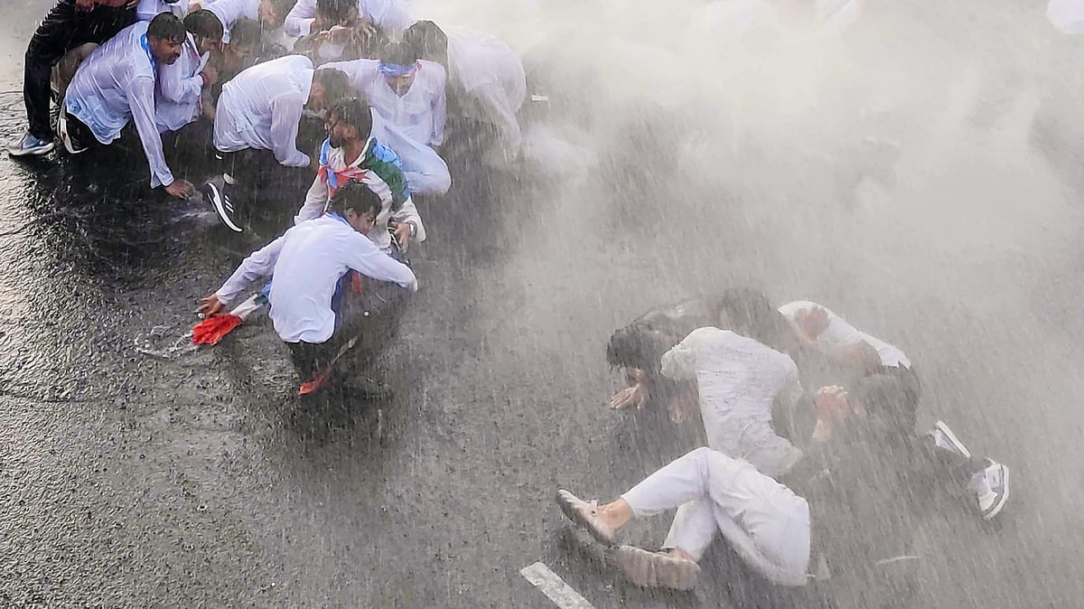 Water cannons being used on NSUI members during a protest over the NEET paper leak in Bhopal, 30 May