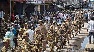 Security personnel marching through Khoda in Ghaziabad, Uttar Pradesh.