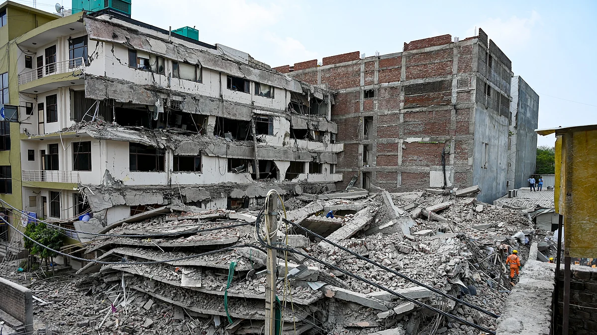 Debris at the site of the commercial building collapse near Saket Metro station in New Delhi.