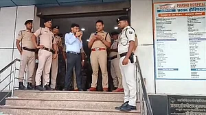 Police personnel investigate at Prasad Hospital in Muzaffarpur.