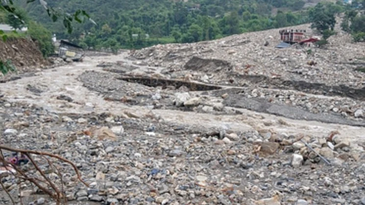 Cloudburst sends water, mud and debris into residential areas, flooding homes, officials say.