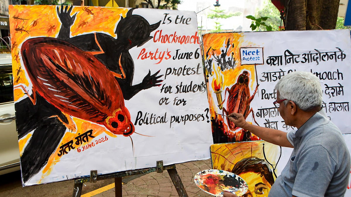 A man works on poster about the CJP in Mumbai, 3 June