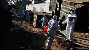 Investigators at the Cleveland informal settlement on 10 June
