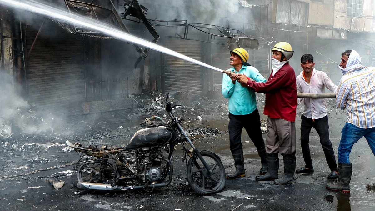Flames erupt from a building near D-Park after a fire breaks out in Rohtak.