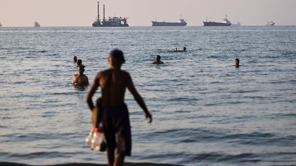 Cargo and commercial vessels anchored in the Strait of Hormuz off Bandar Abbas.