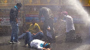 Water cannons disperse NSUI members during a protest over NEET, in Dehradun