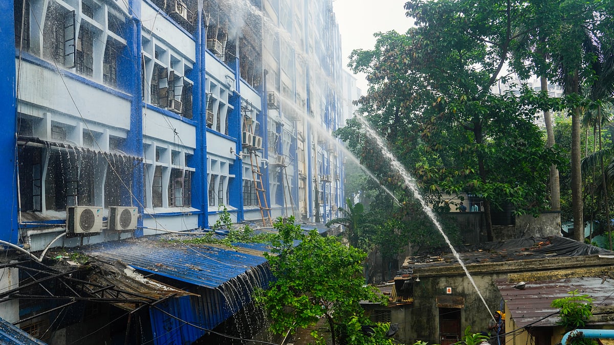Firefighters attempt to douse the fire in Kolkata, 10 June