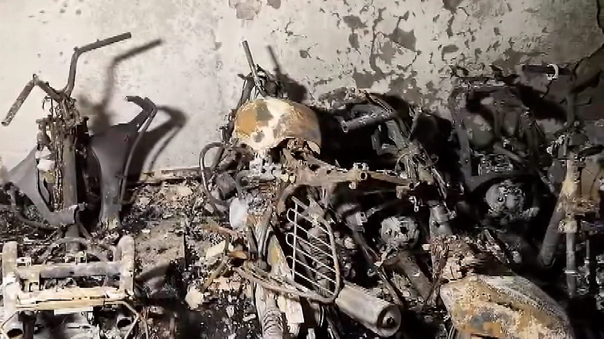 Charred remains of two-wheelers and bicycles at Tughlakabad Extension area in New Delhi.