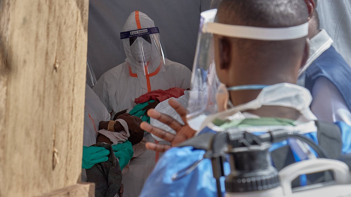Healthcare workers attend to children at an Ebola treatment centre in Bunia.