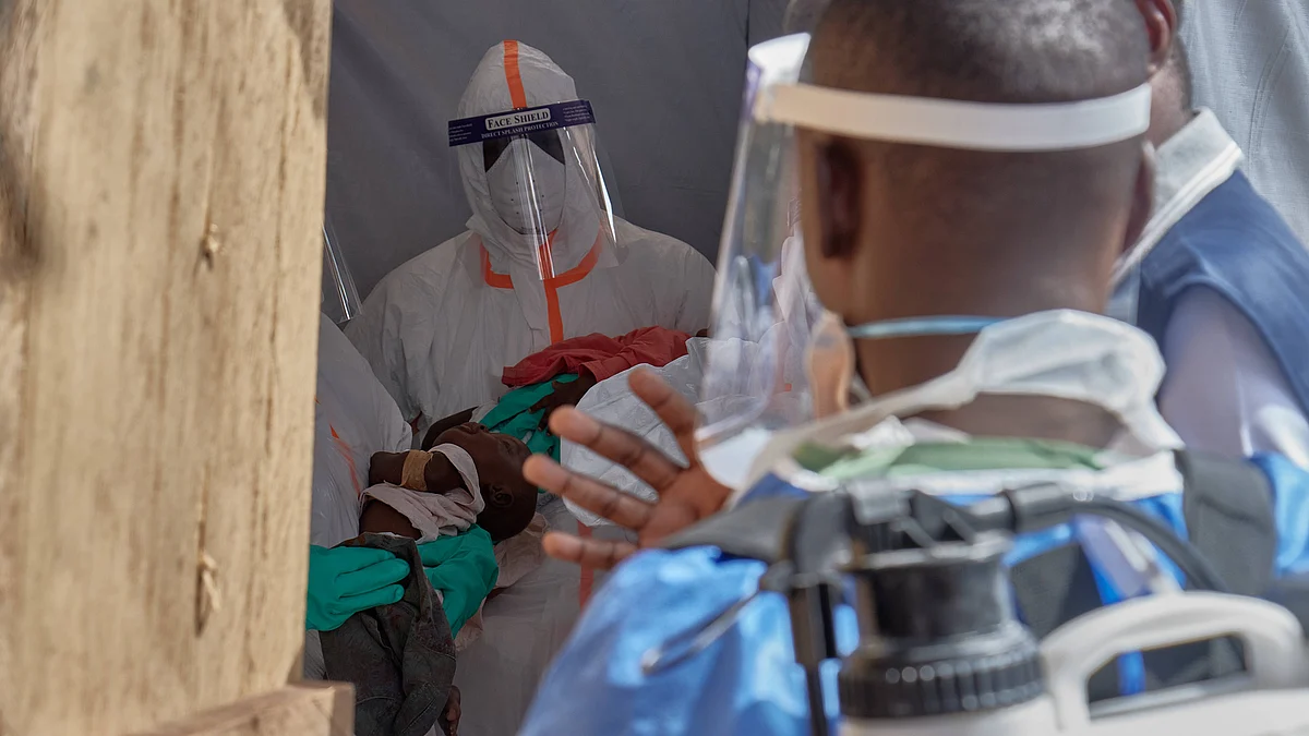 Healthcare workers attend to children at an Ebola treatment centre in Bunia.