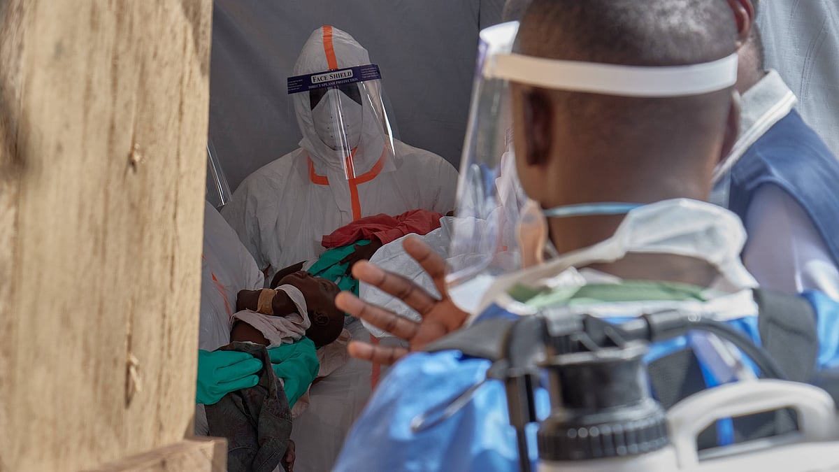 Healthcare workers attend to children at an Ebola treatment centre in Bunia.