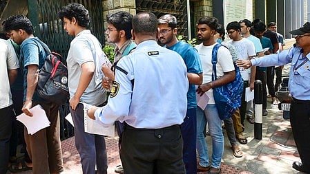 Students line up for their NEET exam
