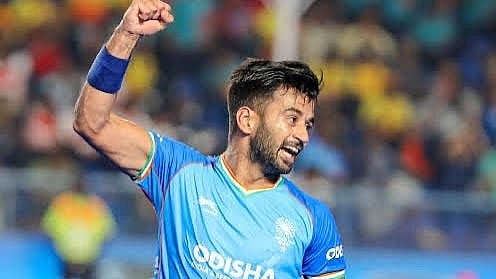 Veteran midfielder Manpreet Singh celebrates during a match.