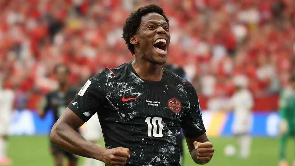 Jonathon David celebrates his
hat-trick against Qatar