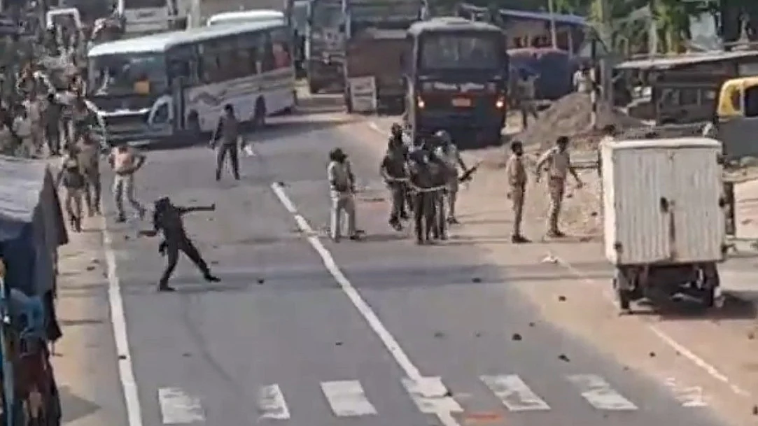 Police in action to disperse protesters during clashes in Nagarnausa, Nalanda.