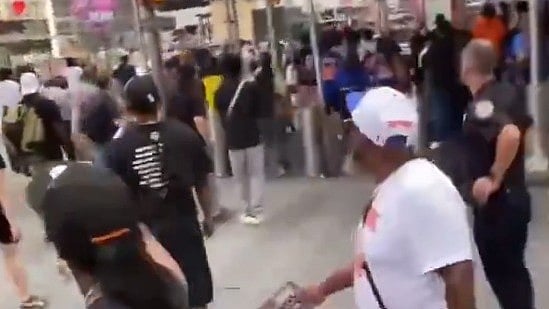 Visitors flee the area as gunfire erupts in Times Square.