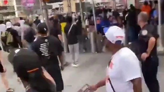 Visitors flee the area as gunfire erupts in Times Square.
