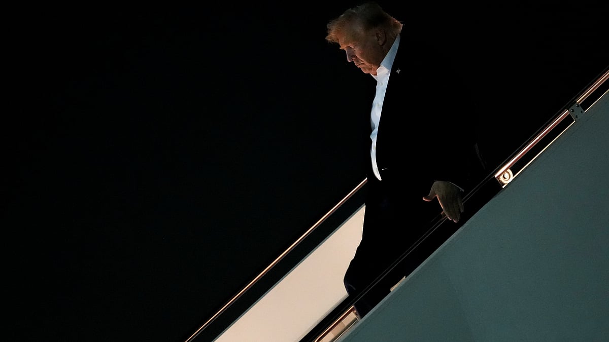 Donald Trump disembarks Air Force One after attending the G7 summit in France, 18 June