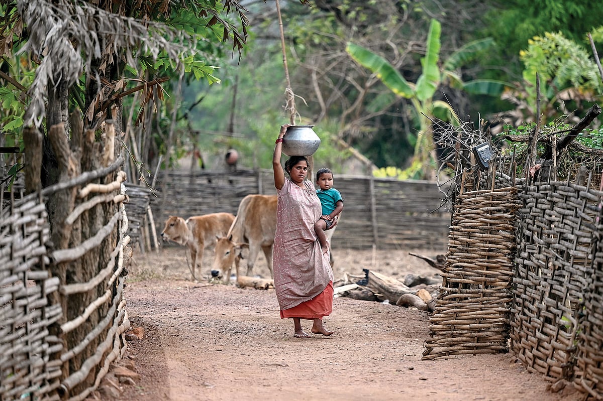 A woman sets out in search of water in Mohandi village in Chhattisgarh