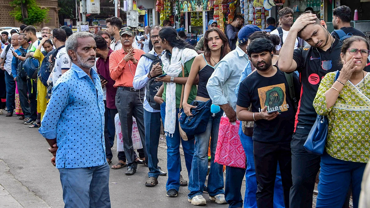 Stranded commuters line up for taxis outside Dadar Station.