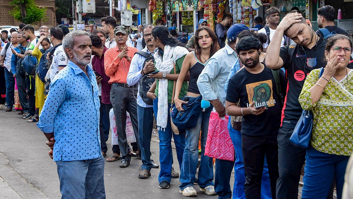Stranded commuters line up for taxis outside Dadar Station.