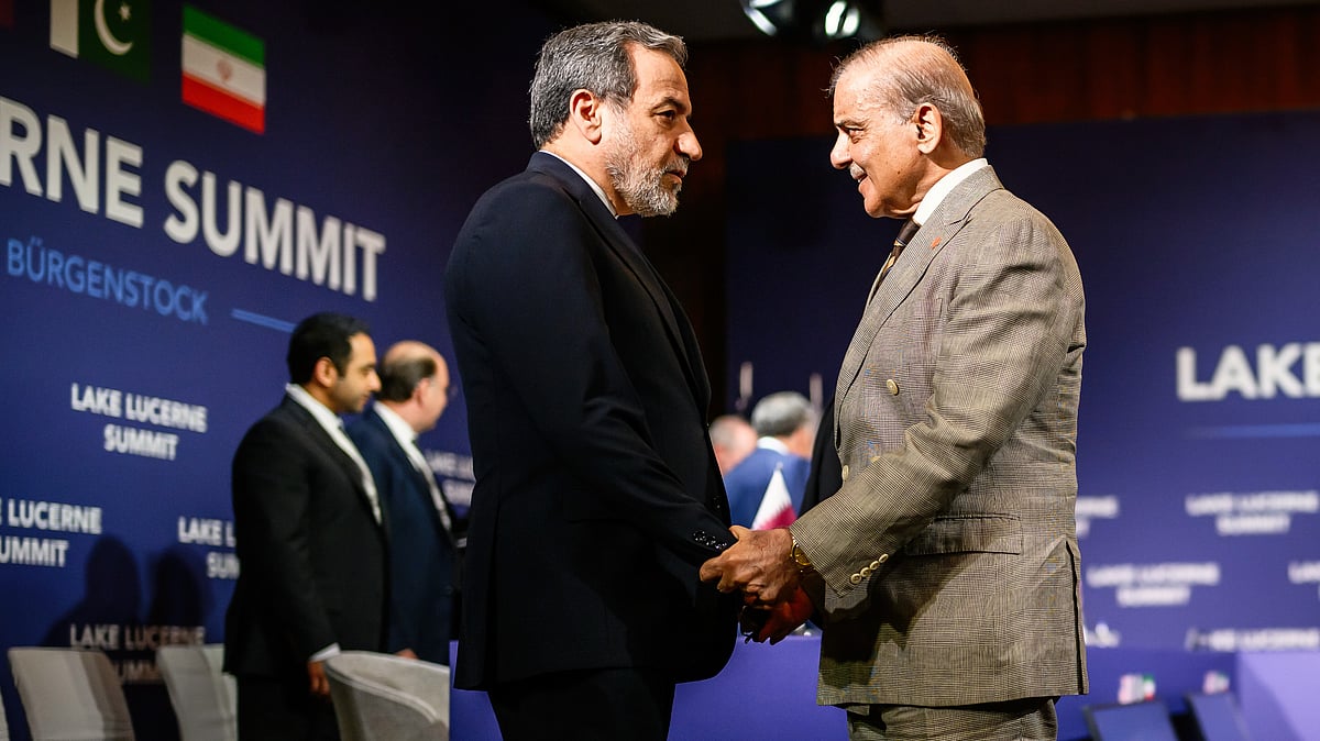 Iran's foreign minister Abbas Araghchi (L) with Pakistan Prime Minister Shehbaz Sharif at Burgenstock