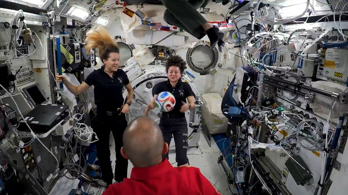 Researchers with the football