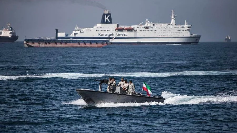 A boat bearing Iran's flag passes through the Strait of Hormuz.