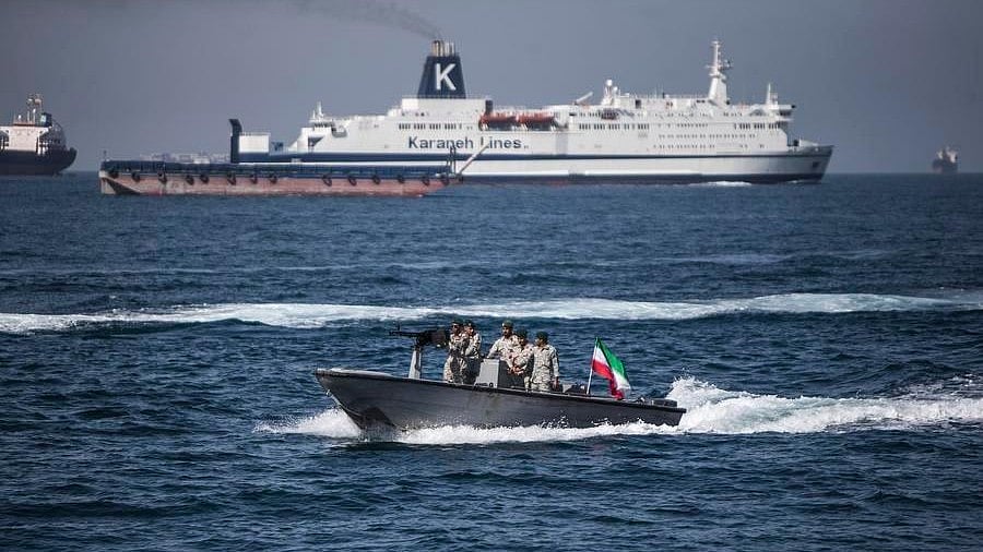 A boat bearing Iran's flag passes through the Strait of Hormuz.