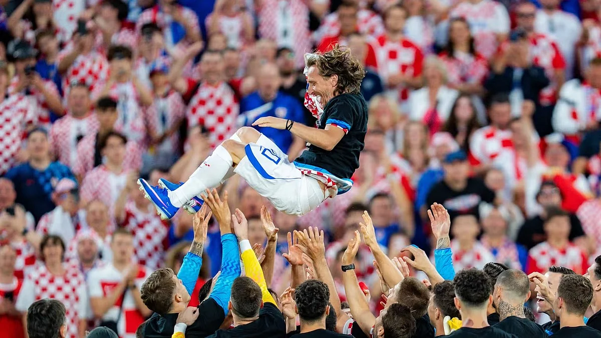 200 and counting: Modric being thrown in the air by his teammates after the landmark