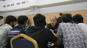 A MWC representative engaging affected migrant workers