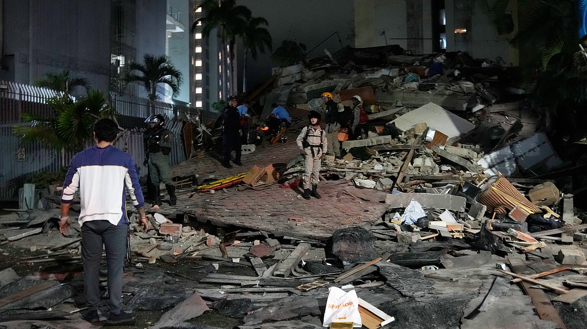 People walk amid debris after an earthquake in Caracas, Venezuela.